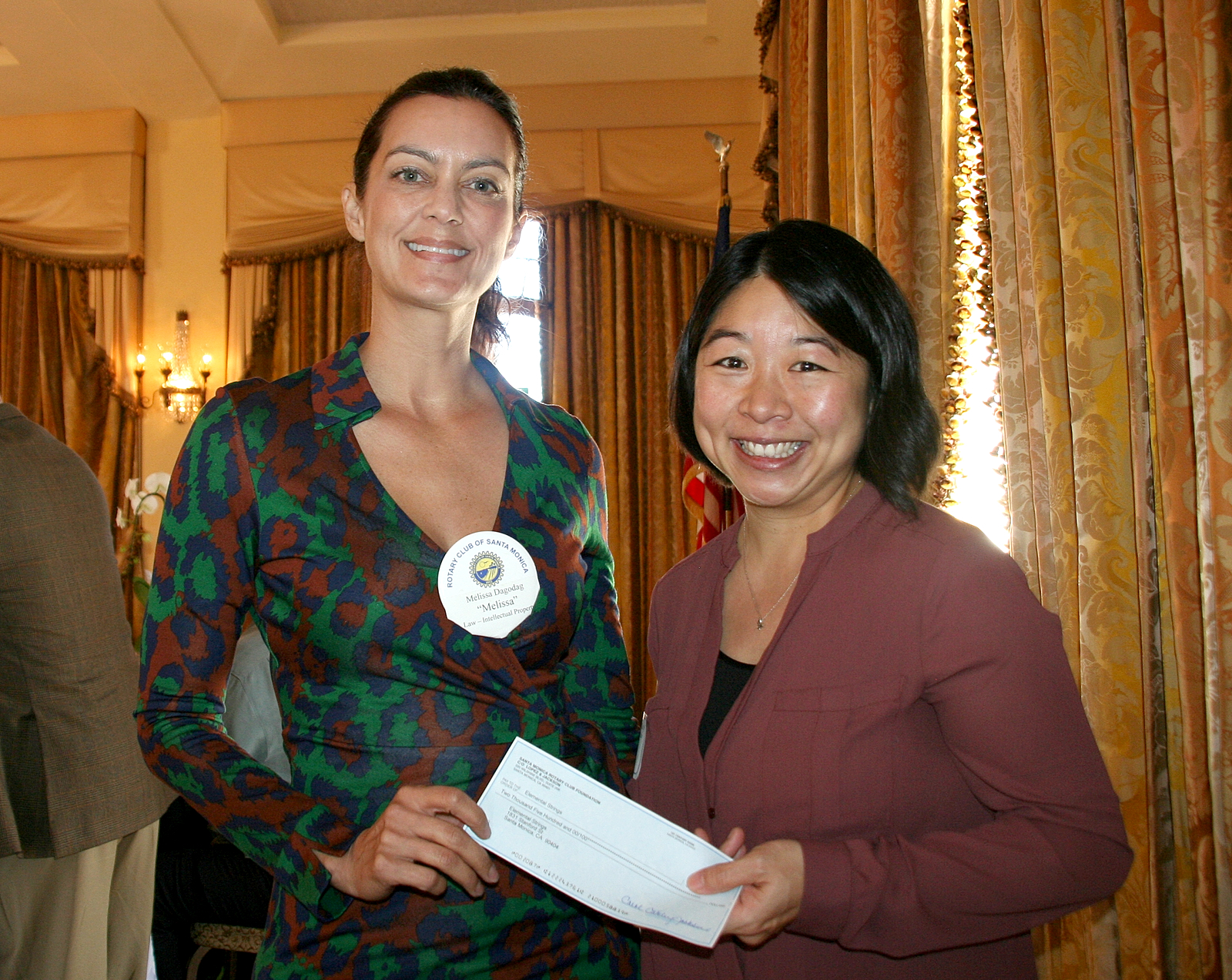 Melissa Presenting a Rotary Grant Check